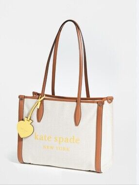 kate spade Beige Canvas Tote with Brown Trim and Yellow Charm